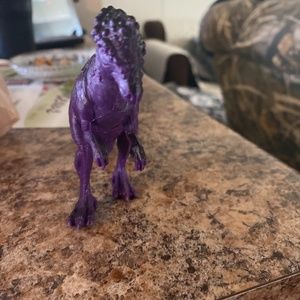 Used purple dinosaur